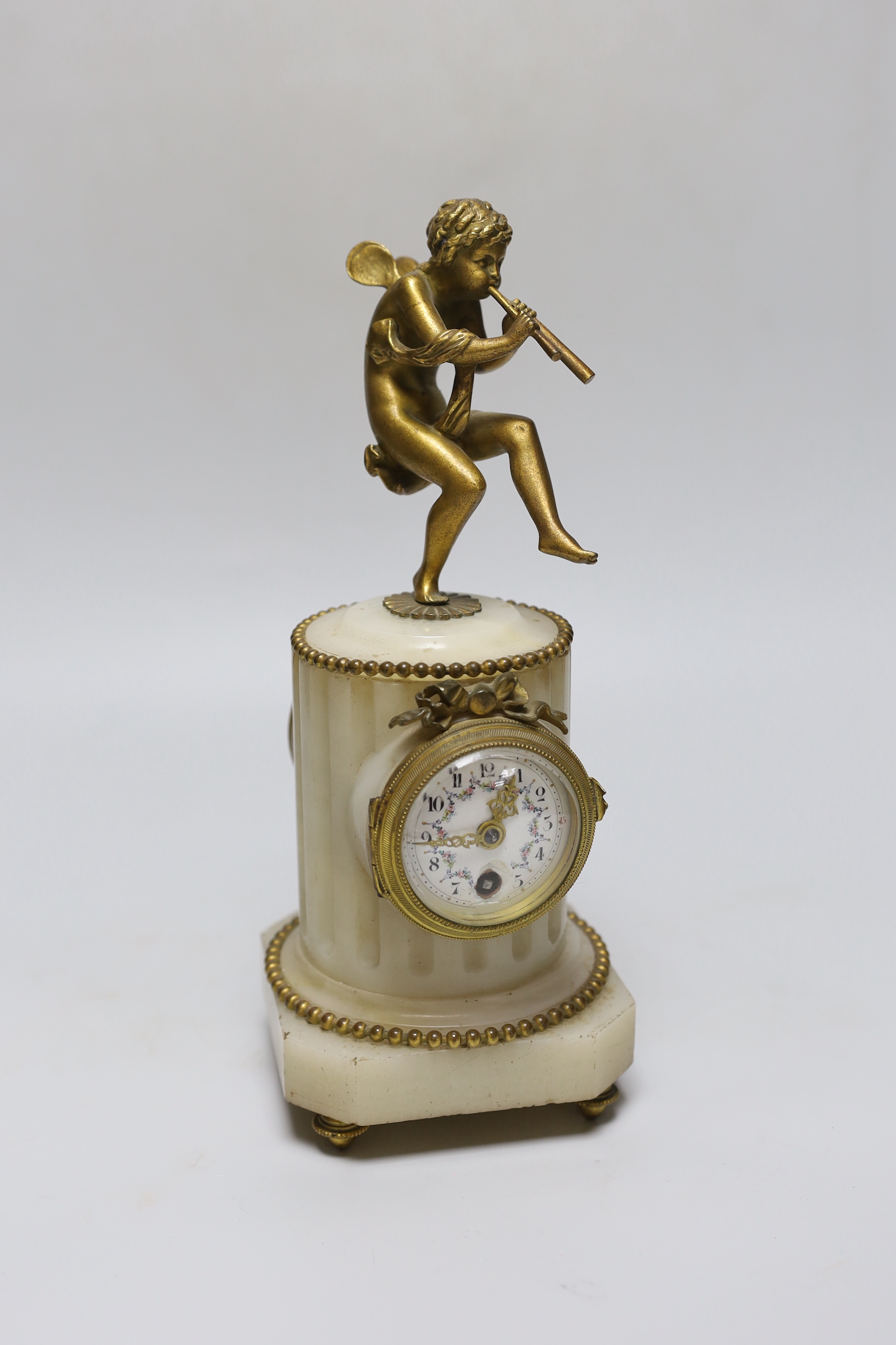 A late 19th century French ormolu mounted onyx mantel clock, 25cm